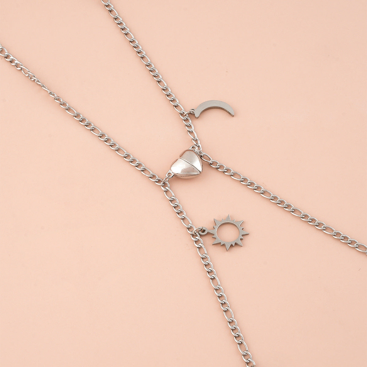 Coppia Bracciali in acciaio con ciondolo (mezzo cuore magnetico)